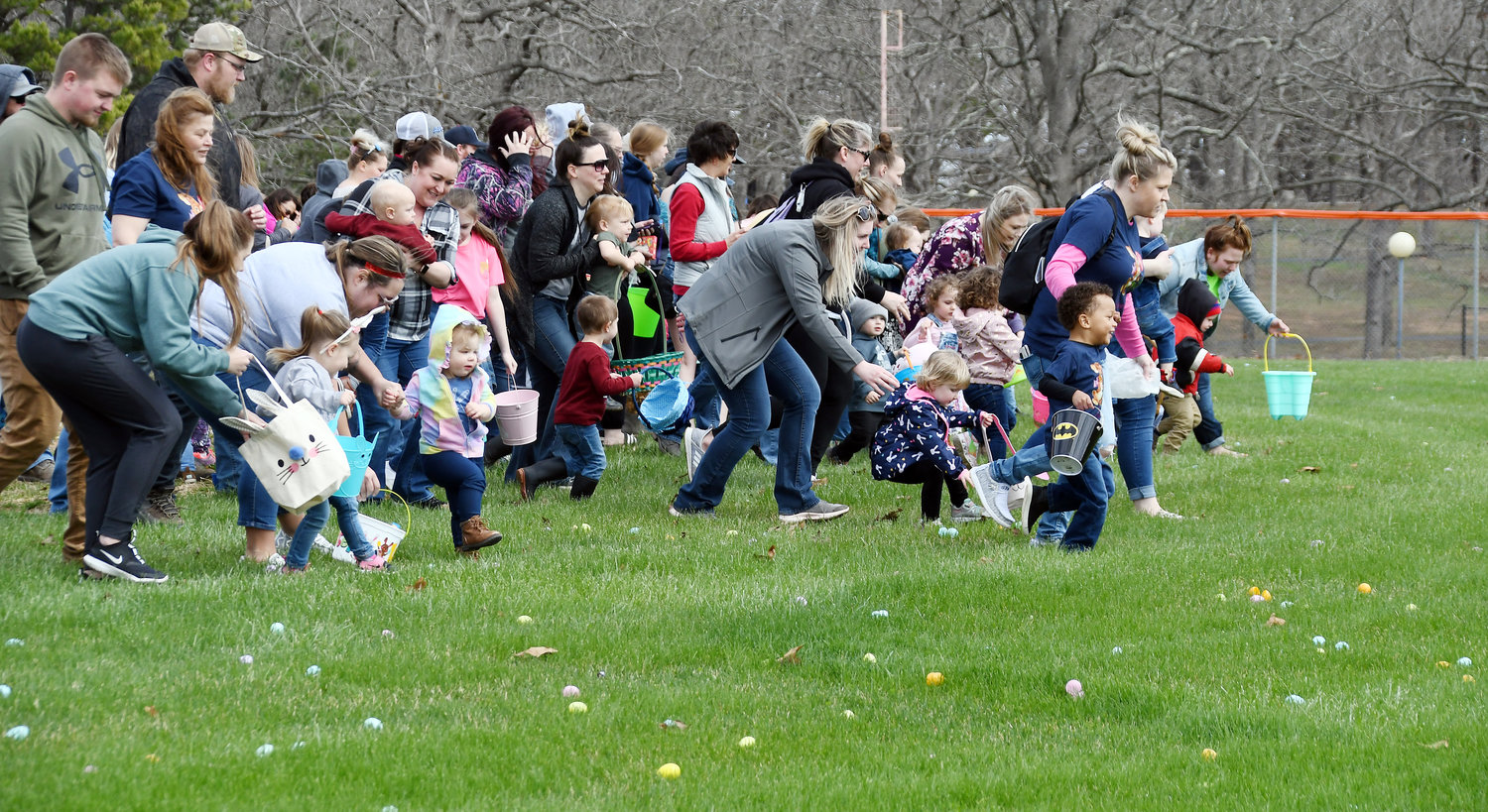 The youngest of the children move off the Memorial Field infield into an outfield well stocked with plastic eggs, some containing special prize baskets provided by supporters of the project.